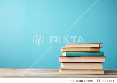 Light blue background and stacked books 02 110874443