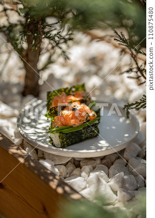 Portion of trendy sushi hand rolls with salmon Portion of trendy sushi hand rolls with salmon 110875480