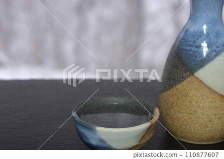 Yukimi sake with sake bottle and choko Yukimi sake with sake bottle and choko 110877607