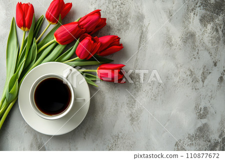 Cup of tea or coffee and tulips on concrete table top view with copy space Cup of tea or coffee and tulips on concrete table top view with copy space 110877672