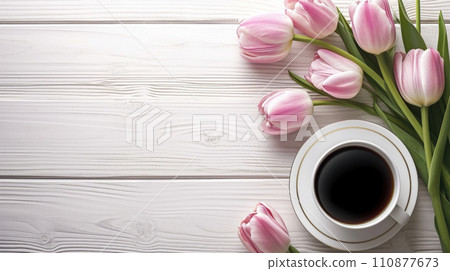 Cup of tea or coffee and tulips on wooden table top view with copy space 110877673