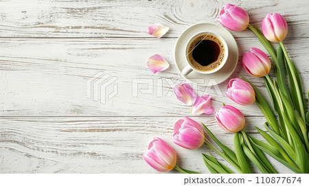 Cup of tea or coffee and tulips on wooden table top view with copy space 110877674