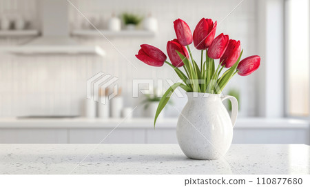 Bouquet of spring tulips in a vase on the kitchen table Bouquet of spring tulips in a vase on the kitchen table 110877680