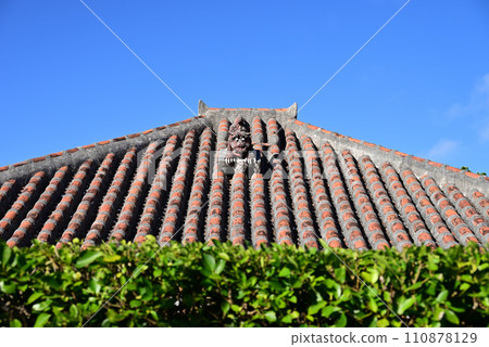 Ryukyu red tiles and shisa dog standing against the blue sky Ryukyu red tiles and shisa dog standing against the blue sky 110878129