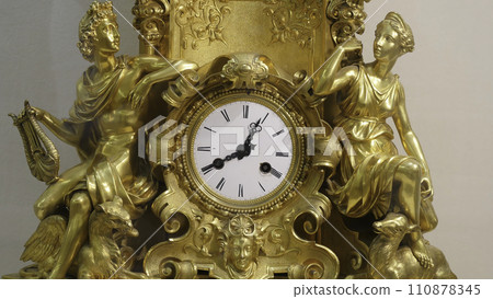 Ancient vintage brass pendulum clock. Vintage gold watch Ancient vintage brass pendulum clock. Vintage gold watch 110878345