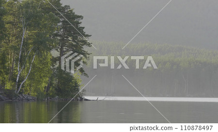 Beautiful blue clear water on the shore of the lake. View of the lake of the woods 110878497