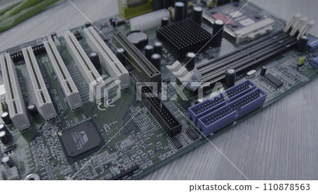 Motherboard close up. Electronic circuit board with processor, close up 110878563