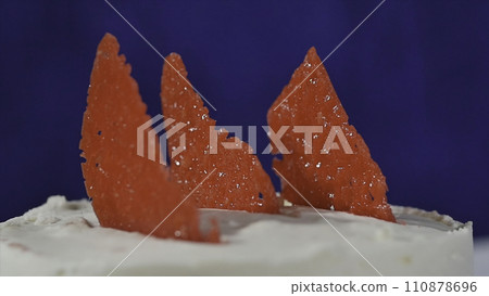 Red decorative element on the cake. Marmalade on the cake. Slice of strawberry cake Red decorative element on the cake. Marmalade on the cake. Slice of strawberry cake 110878696