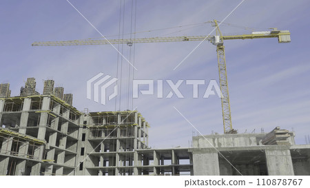 Apartments construction site with crane. Crane and building construction 110878767
