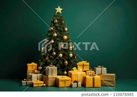 Grey bench and gift boxes under Christmas tree near green wall 110878985