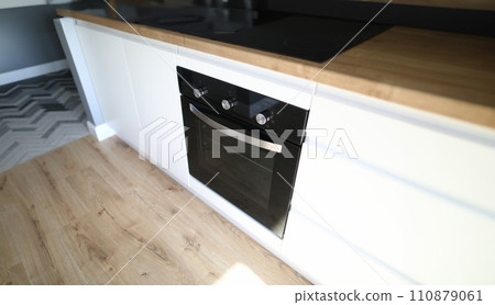 An oven is installed in kitchen furniture apartment 110879061