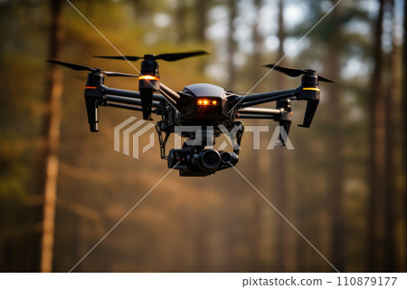The drone with the professional camera takes pictures in the forest. Uav drone copter flying with digital camera. Hexacopter drone with high resolution digital camera on the sky The drone with the professional camera takes pictures in the forest. Uav drone copter flying with digital camera. Hexacopter drone with high resolution digital camera on the sky 110879177