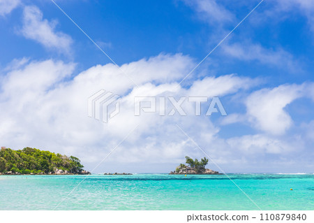 Anse Royale, Seychelles. Coastal view with small island under blue sky Anse Royale, Seychelles. Coastal view with small island under blue sky 110879840
