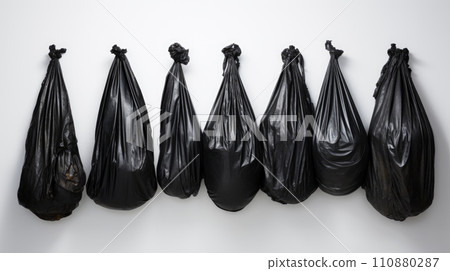 plastic bags black for bin garbage, bag for trash waste, garbage, rubbish, plastic bag pile isolated on white background 110880287