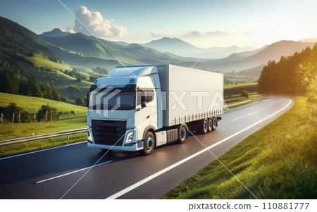 White truck driving on the highway winding through forested landscape at sunrise 110881777