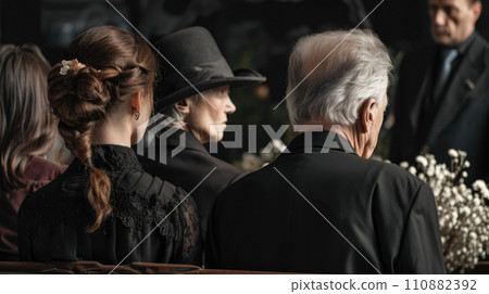 People in black suits on funeral 110882392