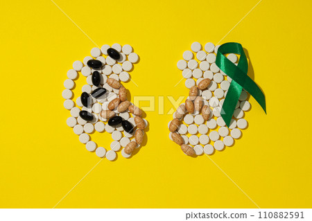 For national kidney month, kidneys on a yellow background. For national kidney month, kidneys on a yellow background. 110882591