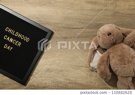 A black board with the inscription Childhood Cancer Day and with a rabbit A black board with the inscription Childhood Cancer Day and with a rabbit 110882628