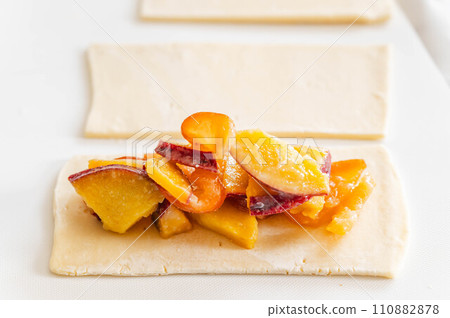 Making apple and sweet potato pie Making apple and sweet potato pie 110882878