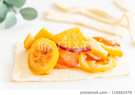 Making apple and sweet potato pie 110882879