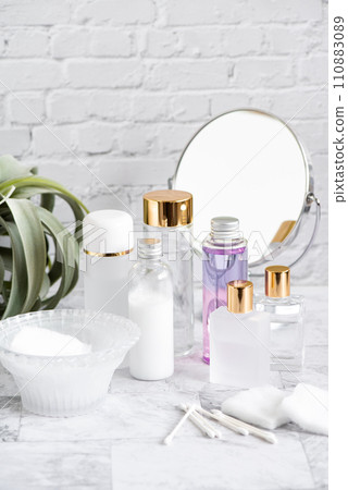 Mirror, cotton, swabs and cosmetic bottle for morning skin care 110883089