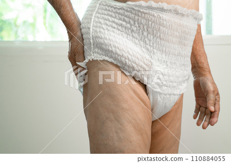 Asian senior woman patient wearing incontinence diaper in hospital, healthy strong medical concept. Asian senior woman patient wearing incontinence diaper in hospital, healthy strong medical concept. 110884055