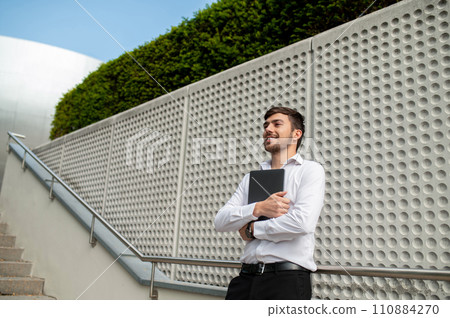 Young handsome businessman in the city street 110884270