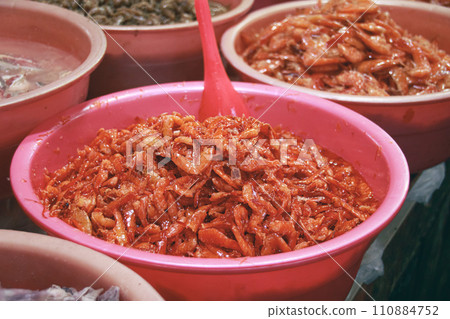 Traditional khmer fermented shrimps called pa ok in a container at a market stall showing the authentic cambodian exotic cuisine and culture. Kampot, Cambodia 110884752