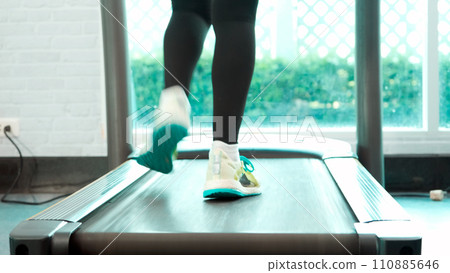 Close up Foot and leg Fitness Asian woman running cool down and stop on treadmill 110885646