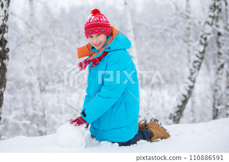 Happy little boy with a big snow globe. Happy winter holidays concept. 110886591