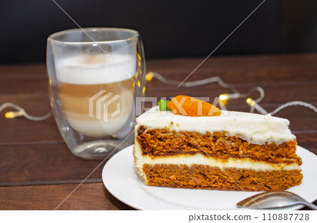 Carrot sponge cake with cream and walnuts and Cappuccino coffee 110887728