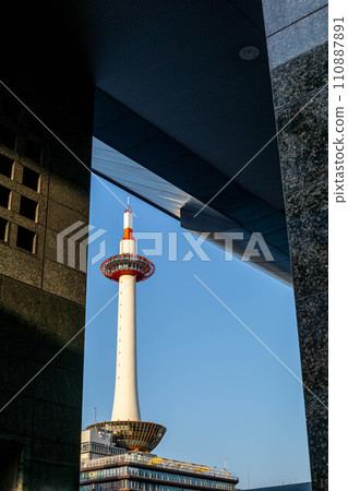 In spring in front of Kyoto Station, you can see Kyoto Tower rising against the blue sky in a picture frame on the wall of the station building. In spring in front of Kyoto Station, you can see Kyoto Tower rising against the blue sky in a picture frame on the wall of the station building. 110887891