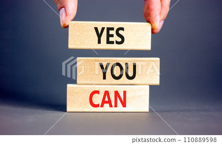 Motivational and Yes you can symbol. Concept words Yes you can on beautiful wooden blocks. Beautiful grey background. Businessman hand. Business motivational and Yes you can concept. Copy space. Motivational and Yes you can symbol. Concept words Yes you can on beautiful wooden blocks. Beautiful grey background. Businessman hand. Business motivational and Yes you can concept. Copy space. 110889598