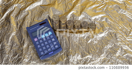 Calculator and 10 ruble Iron coins (written ten rubles, the Bank of Russia). Finance and business concept Calculator and 10 ruble Iron coins (written ten rubles, the Bank of Russia). Finance and business concept 110889936