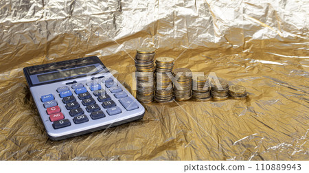 Calculator and 10 ruble Iron coins (written ten rubles, the Bank of Russia). Finance and business concept Calculator and 10 ruble Iron coins (written ten rubles, the Bank of Russia). Finance and business concept 110889943