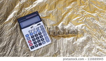Calculator and 10 ruble Iron coins (written ten rubles, the Bank of Russia). Finance and business concept Calculator and 10 ruble Iron coins (written ten rubles, the Bank of Russia). Finance and business concept 110889945