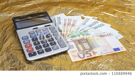 Calculator on a pile of EURO bills. Finance and business concept Calculator on a pile of EURO bills. Finance and business concept 110889946