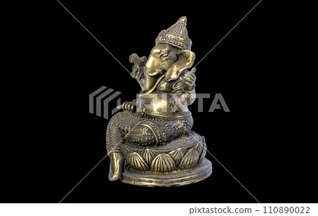 Hindu God Ganesh (Ganesha) Statuette, isolated on a black background 110890022