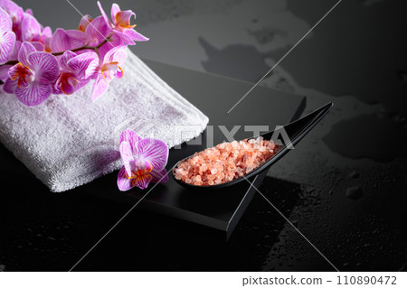 Beautiful blooming orchid flowers and pink sea salt. 110890472