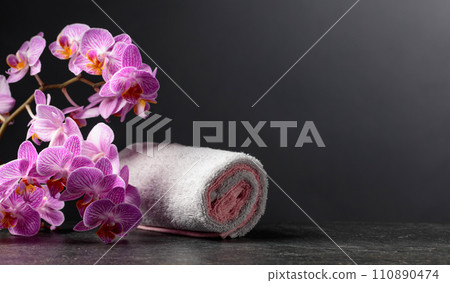 Beautiful blooming orchid flowers with towels. 110890474