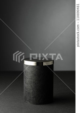 Black podium on a black background. 110890481