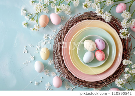 Easter rainbow pastel table setting for dinner with ceramic plates, blossom and easter eggs 110890841
