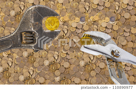 Allegory of the global financial crisis - Iron 10 rubles coin (written ten rubles, the Bank of Russia) in the grip of economic crisis. Finance and business concept 110890977