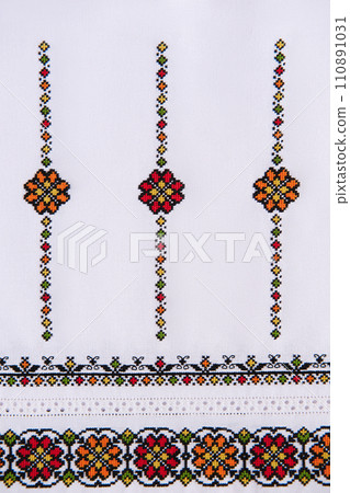 Texture of linen white fabric with embroidered element. Ukrainian embroidery pattern for folk shirt. Texture of linen white fabric with embroidered element. Ukrainian embroidery pattern for folk shirt. 110891031