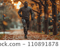 athlete with futuristic prosthetic legs jogging in the park 110891878