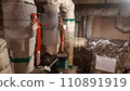 Thermal insulation pipes in the heating unit in the basement of an apartment building 110891919