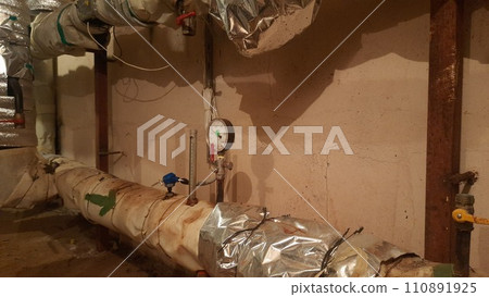 A heating unit from the inside in the basement of an apartment building 110891925