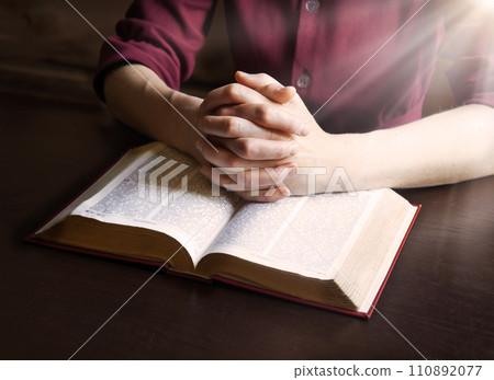 Woman's hands holding a bible Woman's hands holding a bible 110892077