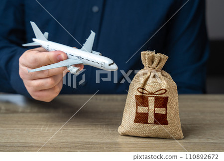 Gifts and rewards in the flight loyalty program. Low-cost airlines. Discounted flights. Traveler earn a percentage of his expenses back, transforming travel into a financially rewarding. Gifts and rewards in the flight loyalty program. Low-cost airlines. Discounted flights. Traveler earn a percentage of his expenses back, transforming travel into a financially rewarding. 110892672
