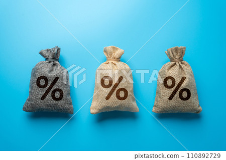 Three bags with percent signs. Discounts, savings or investment. The best conditions for deposits and loans. Banks and banking. Three bags with percent signs. Discounts, savings or investment. The best conditions for deposits and loans. Banks and banking. 110892729
